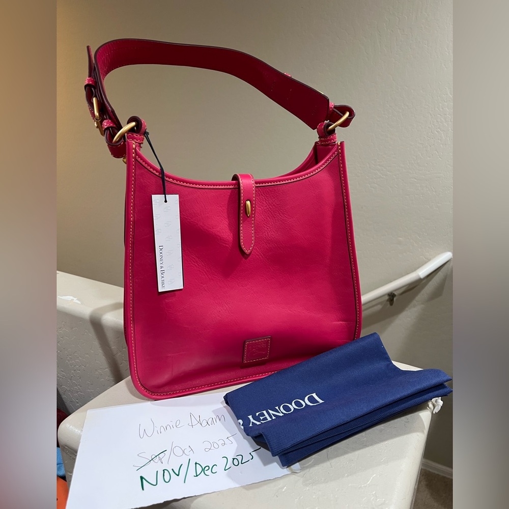 Dooney and Bourke large messenger florentine fuschia